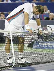 Pete Sampras of the USA leans on the net