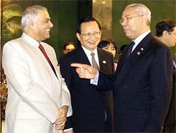 US Secretary of State Colin Powell shares a light moment with Indian Foreign Minister Yashwant Sinha and China's Foreign Minister Tang Jiaxuan