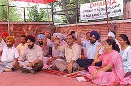 Employees of Jalandhar Doordharshan Kendra hold a rally