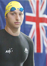 Australia�s Ian Thorpe stands by a Australian flag 