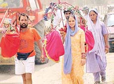 Kavadias of Nakodar return home along with holy water of the Ganges from Hardwar.
