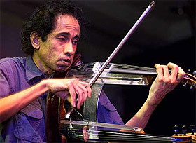 India's world famous violinist and musician Shankar plays a violin