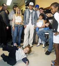 Brazilian soccer star Ronaldo Nazario and his wife Milene watch their son Ronald