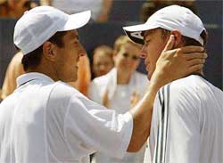 Guillermo Canas of Argentina consoles second seed Marat Safin