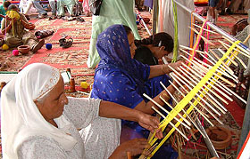 Inmates of the All-India Pingalwara Charitable Society make traditional 'nalas'