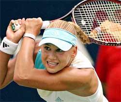 Anna Kournikova follows through with a backhand shot