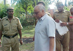 Fatehabad City Magistrate R. C. Pawaria proceeds to surrender in court 