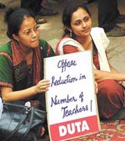 Teachers protest outside the UGC building on Monday 