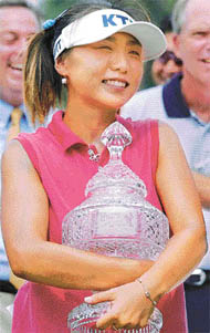 Mi Hyun Kim of South Korea hugs the Wendy's Championship trophy