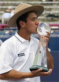 Guillermo Canas of Argentina, kisses the trophy