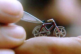 Chaman Lal Verma of Patiala, busy on giving final touch to a bicycle, having weight half gram, length 2.5 cm, width 1.75 cm, claimed to be the smallest bicycle in the world