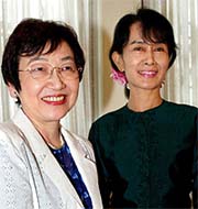 Myanmar Opposition leader Aung Sang Suu Kyi and visiting Japanese Foreign Minister Yoriko Kawaguchi pose for media