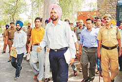 Students of Panjab University being taken to the Sector 11 police station in Chandigarh on Wednesday.