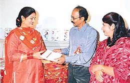 A participant being awarded a certificate at a function