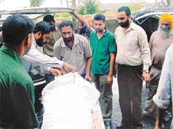 Relatives of Jaswinder Singh Bhullar, a former CRPF official, with his body