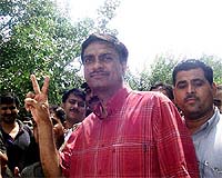 Tehelka dot com reporter Anirudh Behl showing victory sign