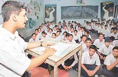 A student of Government Senior Secondary School, Sector-46, at a paper-reading contest on the school premises in Chandigarh on Friday.
