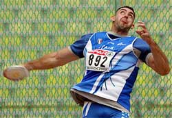 Italy's Cristiano Andrei throws a discus