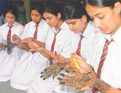 Students of KVM participate in a mehndi competition