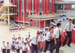 Students stream out of auditorium at Kundan Vidya Mandir