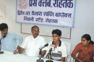 Mamta Kharab, member of the victorious hockey team interacting with mediapersons at a function organised by the Press Club, Rohtak.