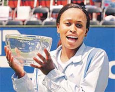 Chanda Rubin, from Lafayette holds the championship trophy