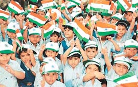Students of The Gurukul wave the Tricolour during the Independence Day celebrations