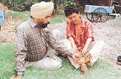 Mr Prem Singh Bhutte shares his concern with a patient of leprosy.