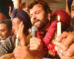 Punjabi singer Hans Raj Hans during candle light vigil