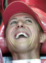 Germany's Ferrari driver Michael Schumacher smiles during the first free practice