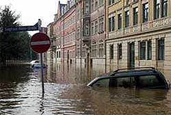 Cars float in a flooded street in the eastern German town of Pirna on the Elbe river
