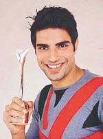 Rajat, with his ��Kingfisher Face of the Year-2002�� trophy.
