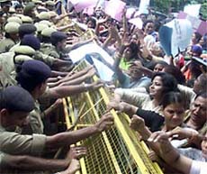 Congress activists demonstrate before the official residence of Communication Minister Pramod Mahajan