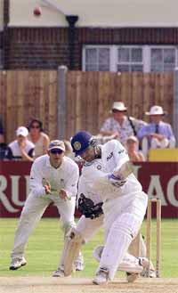 India's Virender Sehwag, sends a ball off Tim Philips of Essex over the River Stand into the river for 6