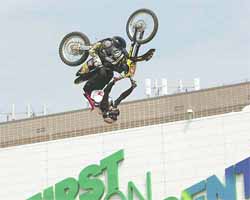 An upside-down Mike Metzger successfully executes a backflip, called the 'Godfather,'