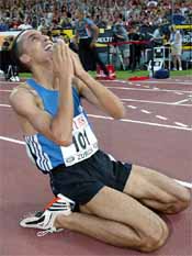 Brahim Boulami of Morocco raises his hands as he celebrates his new world record 
