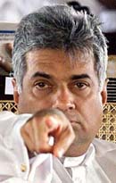 Sri Lanka Prime Minister Ranil Wickremesinghe points from his chair 
