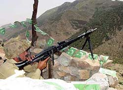 A Pakistani soldier holds machine gun