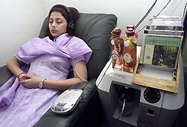 A woman listens to music while breathing pure oxygen