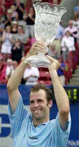 Britain�s Greg Rusedski holds the championship trophy