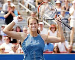 Amelie Mauresmo of France celebrates her 6-4 6-1 victory over Jennifer Capriati