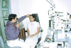 Dr Ajeet Bhardwaj examines a patient in his clinic