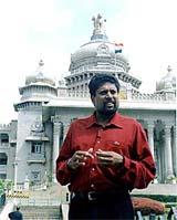 Indian cricketer of the century Kapil Dev posing in front of the Vidhan  Sabha
