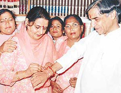 Mayor Lalit Joshi ties a rakhi to MP Pawan Bansal in Chandigarh on Thursday.