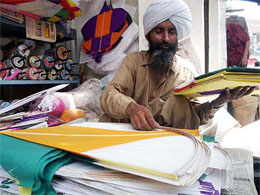 A shopkeeper sells kites