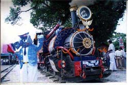 A railway guard wearing the costume of a mascot 