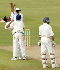 India's Zaheer Khan and Ajit Agarkar celebrate taking the wicket