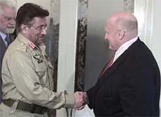 Pakistan President Pervez Musharraf greets US Deputy Secretary of State Richard Armitage in Islamabad on Saturday