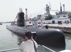 A cameraman films an Agosta Class submarine in Karachi on Saturday