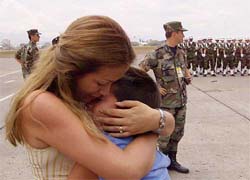 Colombian Steven Rojas is hugged by his mother